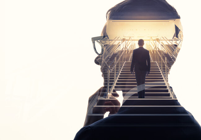 Double exposure of a businessman and stairs. Success of business concept.